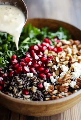 Pomegranate, Kale, and Wild Rice Salad with Walnuts and Feta