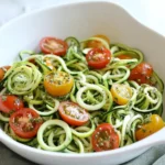 Raw Spiralized Zucchini Noodles with Tomatoes and Pesto