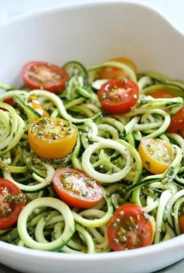 Raw Spiralized Zucchini Noodles with Tomatoes and Pesto