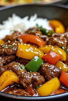 Black Pepper Beef Stir-Fry with Rainbow Peppers and Sesame Finish