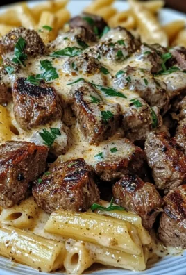 Cajun Steak Tips with Penne in Creamy Parmesan Cheese Sauce